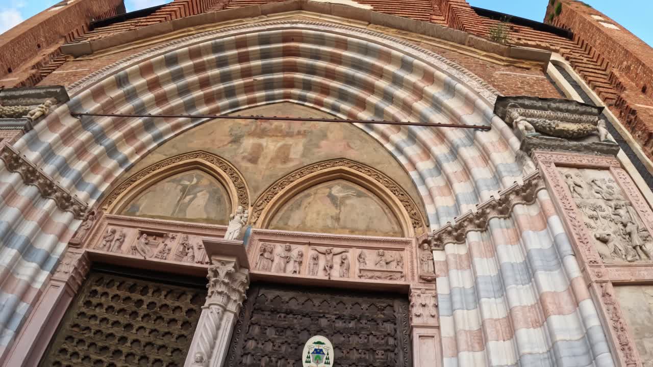 Gothic masterpiece showcasing ornate walls, frescoes, and sacred art in Verona
