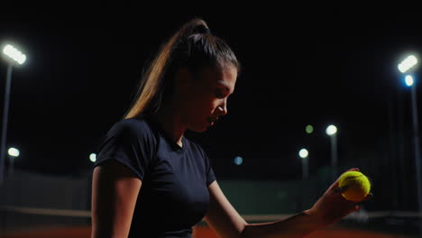 female tennis player at night