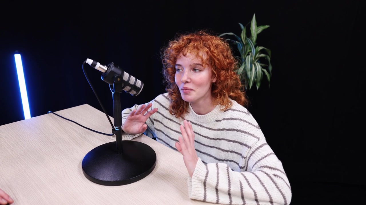 Young Woman Recording a Podcast Interview in a Studio