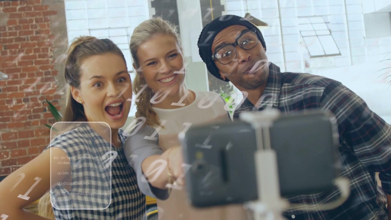 Center woman extending holder, tapping phone, team leaning in for marketing with phone-synced UI