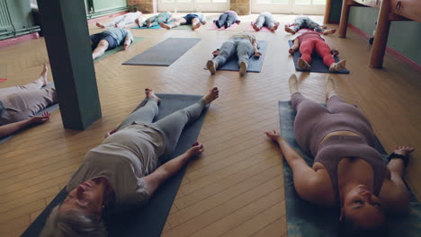 yoga class in relaxation pose