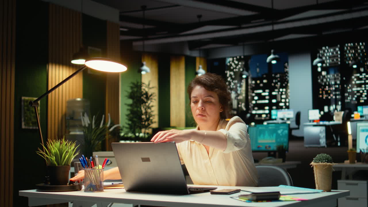 Vertical Video Businesswoman seeing the time as she concentrates on a complex task