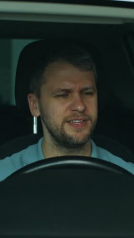 man driving a car