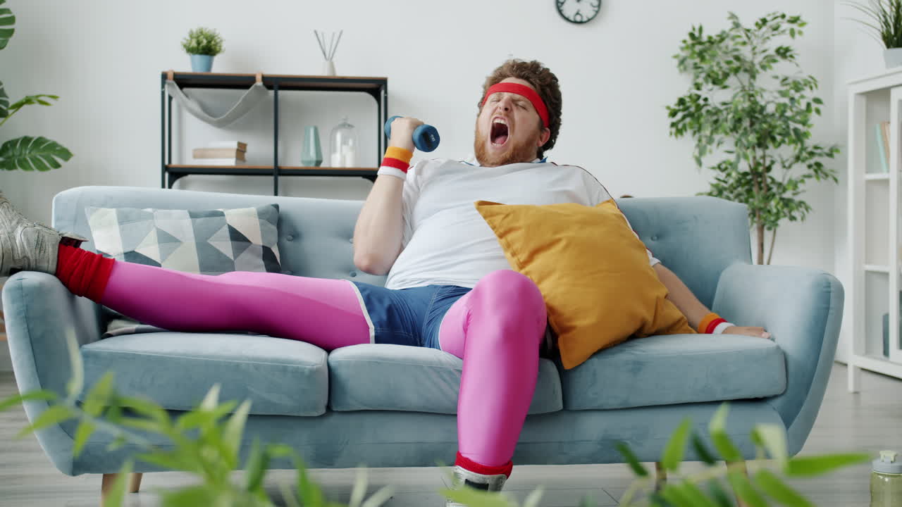 Funny Man Working Out on the Couch