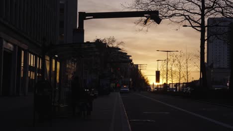 sunset silhouette of pantograph at energy station to supply electric buses renewable electricity