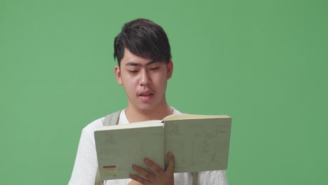 young man reading a book