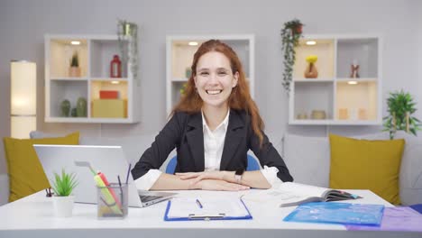 home office worker woman expressing her mind and success to the camera.