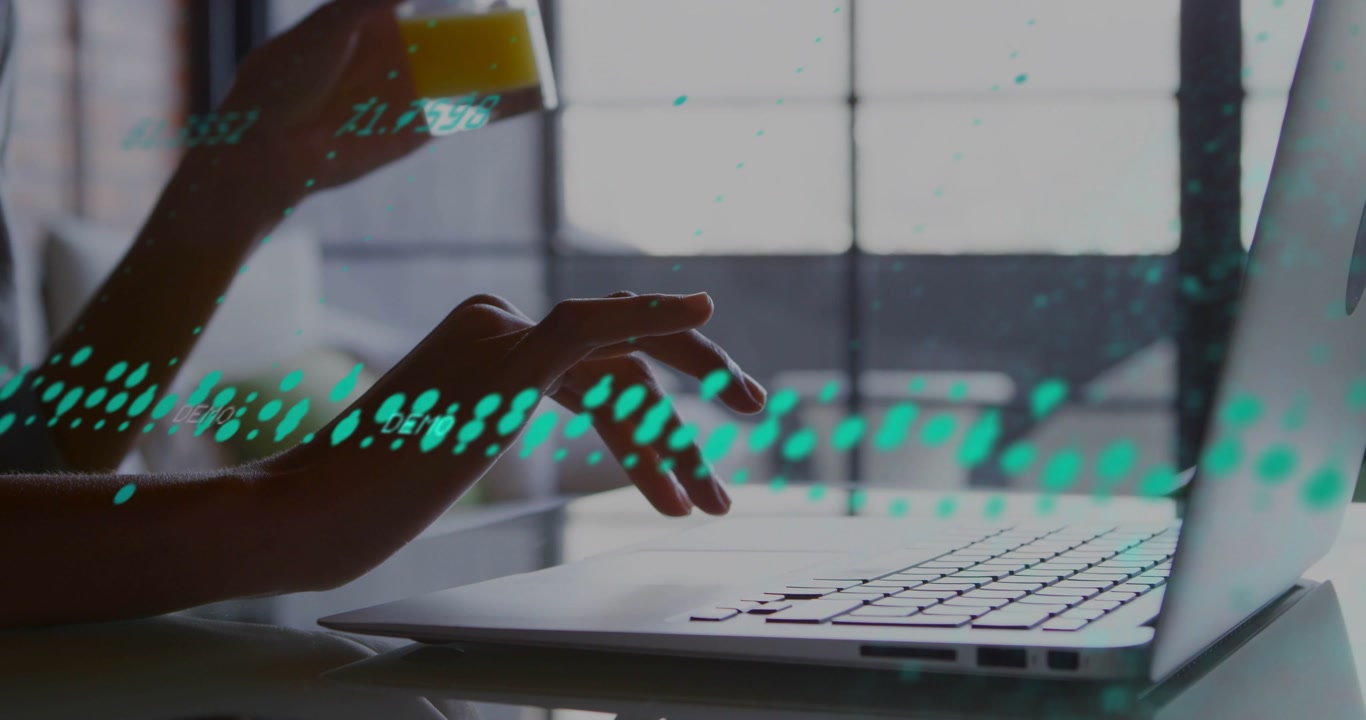 Woman typing after right-hand hover on laptop tech, sipping juice, teal waveform moving over keys