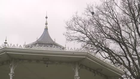 ornate white bandstand in a park