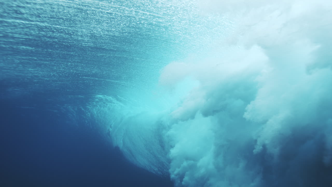 Misty foam dissipates in water revealing cloud like mess of vortex at Cloudbreak Fiji