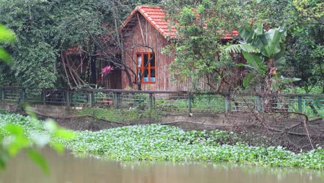 a serene view of a cabin beside water