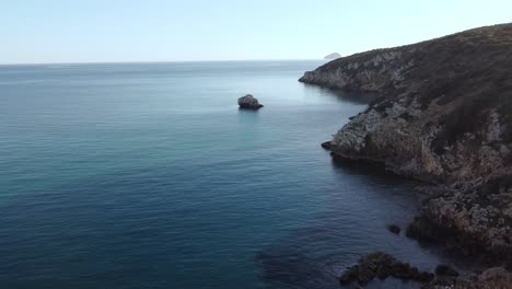 Stunning-aerial-of-secluded-bay-in-South-Sardinia,-Maladroxia-beach,-dolly-in