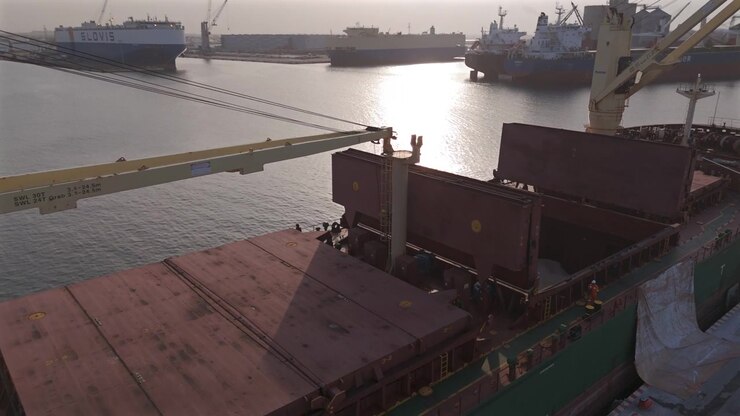 Bulk cargo ship with open holds and deck cranes in the Port of Veracruz, Mexico