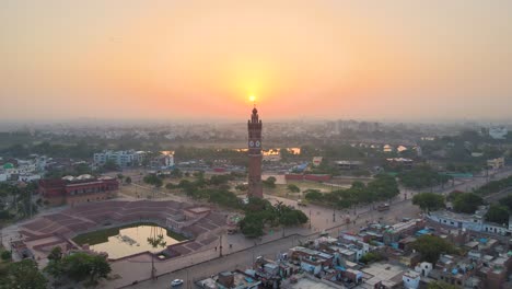 aerial view of lucknow, capturing the clock tower and its historical surroundings under the golden light of dawn.