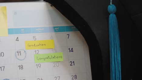 graduation cap on a paper calendar countdown planning for graduation day