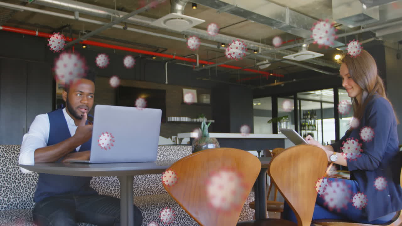 Animation of macro coronavirus Covid-19 cells spreading over people working in a coffee shop