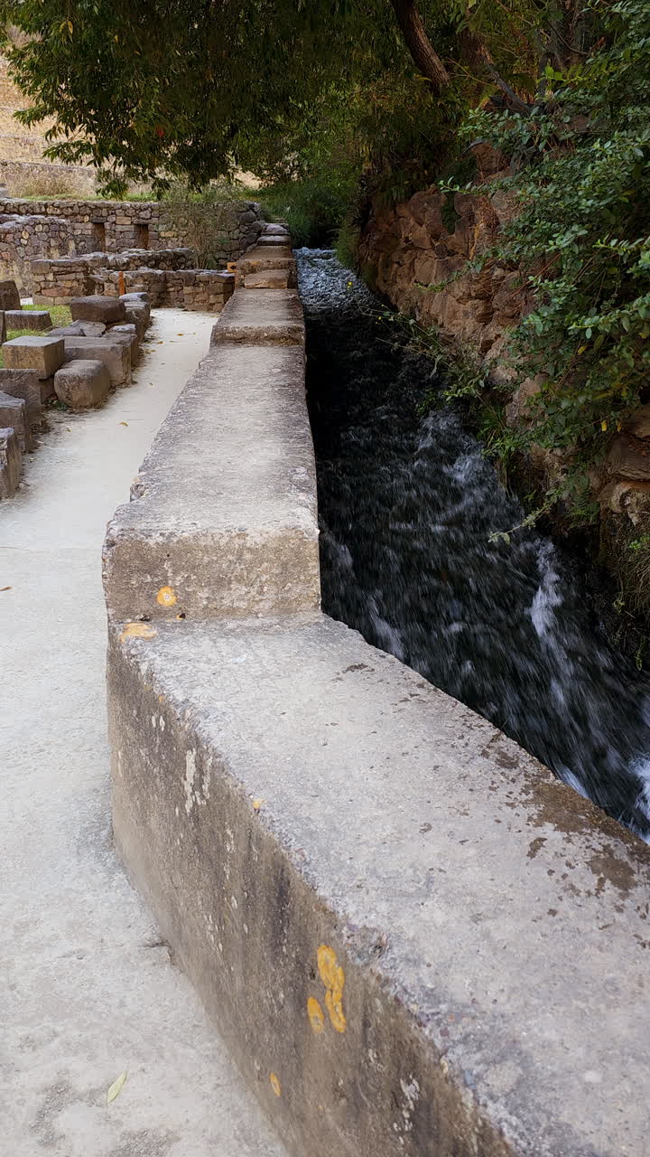 Impressive ancient engineering of the Incas, highlighting the rerouting of a river to serve the agricultural and ceremonial needs of the archaeological site of Ollantaytambo, Peru