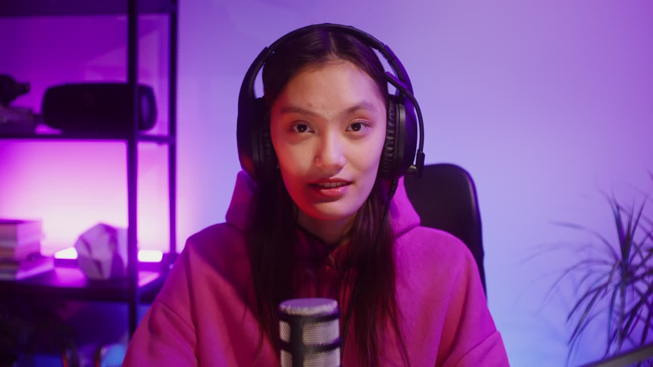 Female Gamer with Headphones and Microphone
