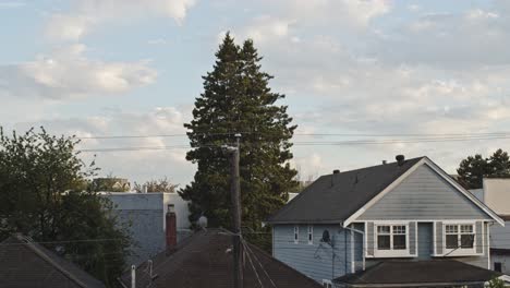 clouds advancing over homes in vancouver, in the afternoon