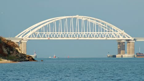 white arch bridge over waterway