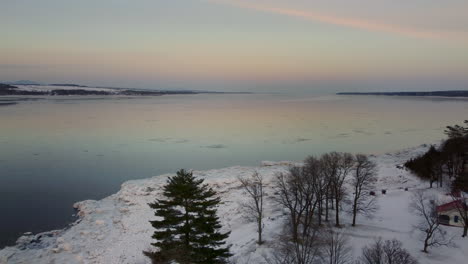 aerial - flying towards the st-lawrence river at sunset