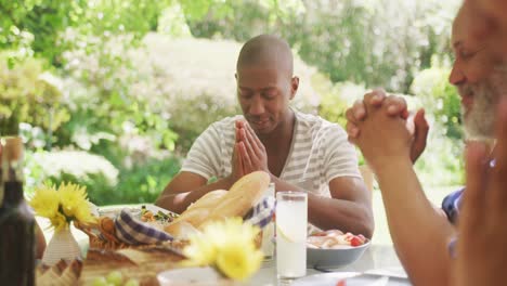 multi-generation african american family spending time in garden together