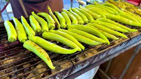 green peppers grilling at khlong lat mayom market