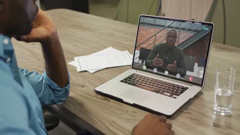 African-american-businessman-using-laptop-for-video-call-with-african-american-business-colleague