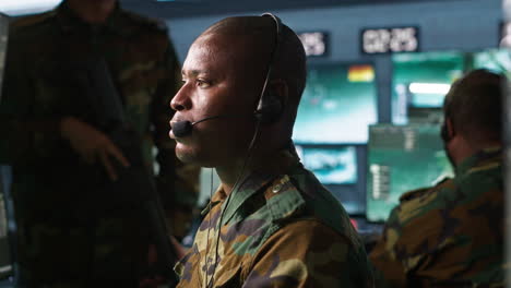 Military-dispatcher-managing-communications-networks,-doing-patriotic-duty