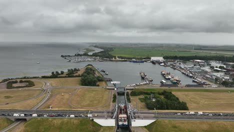 top view of large vessel entering stellendam sea lock from buitenhaven