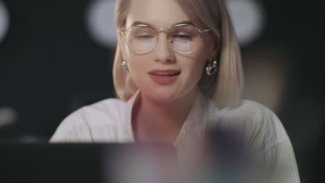 Satisfied business woman looking laptop