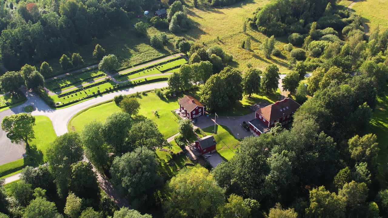 Beautiful aerial view of the lush landscape of Skållerud, Sweden, showcasing greenery and rural homes