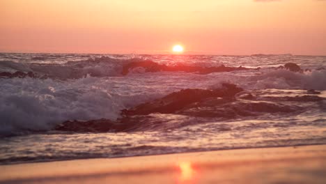 Wave-crashing-in-slow-motion-in-front-of-sunset-in-California