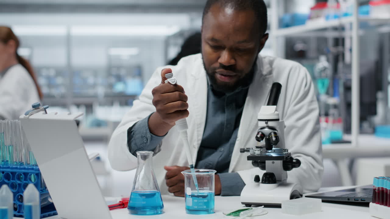 Assay development expert pipetting reactant into solution for purity analysis