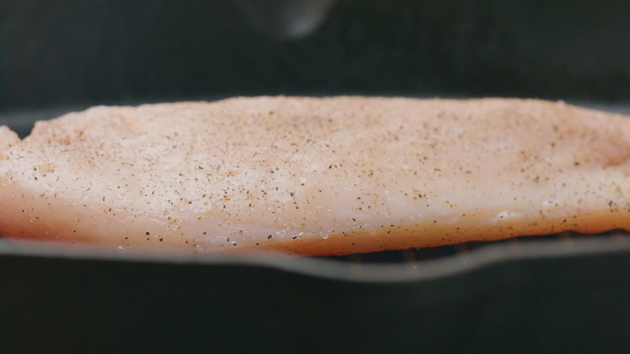 Cooking Chicken Fillet on Hot Grill