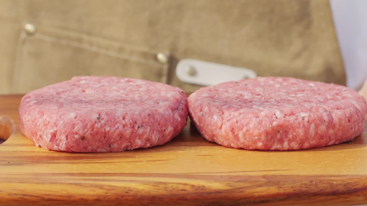Raw Burger Patties on Wooden Cutting Board