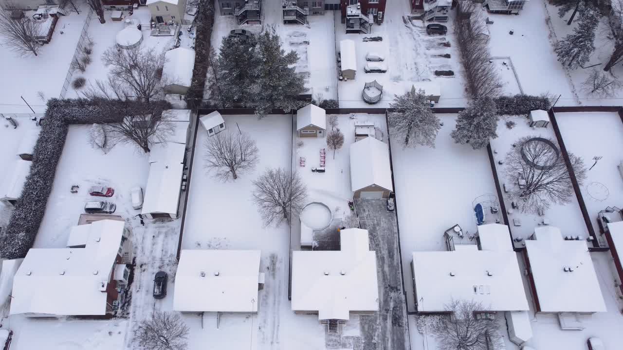 Top view of a residential area in the city of Saint Constant during the day covered in snow, Quebec, Canada