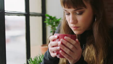 Thinking,-window-and-sad-woman-drink-tea