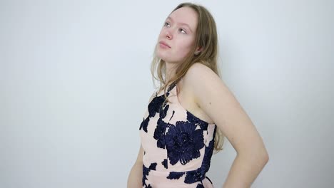 young woman in dress dancing and posing