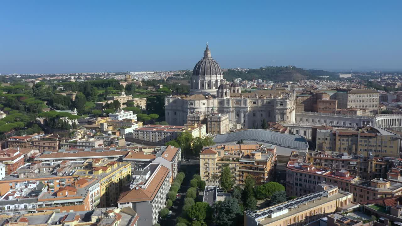 Aerial drone descending above the Vatican, showcasing the dome of St. Peter’s Basilica and the iconic square from Roman neighborhood, Italy