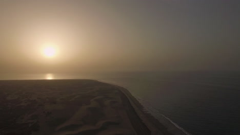 coast with sand dunes at sunset gran canaria