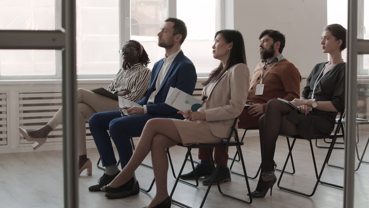Multiethnic Colleagues Sitting in Conference Room