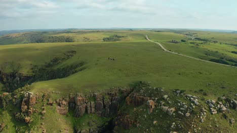 Experience-the-breathtaking-beauty-of-Wales-as-a-group-of-riders-gracefully-navigate-the-sunlit-cliffs-on-horseback