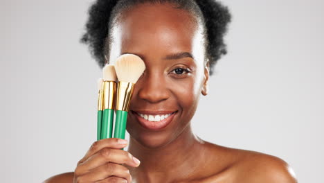 Face-smile,-makeup-and-black-woman-with-brushes