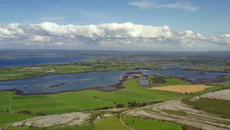 irish rural landscape, view from east burrin looking towards kinvara bay, clare, ireland, august 2020, drone gradually pushes east towards galway