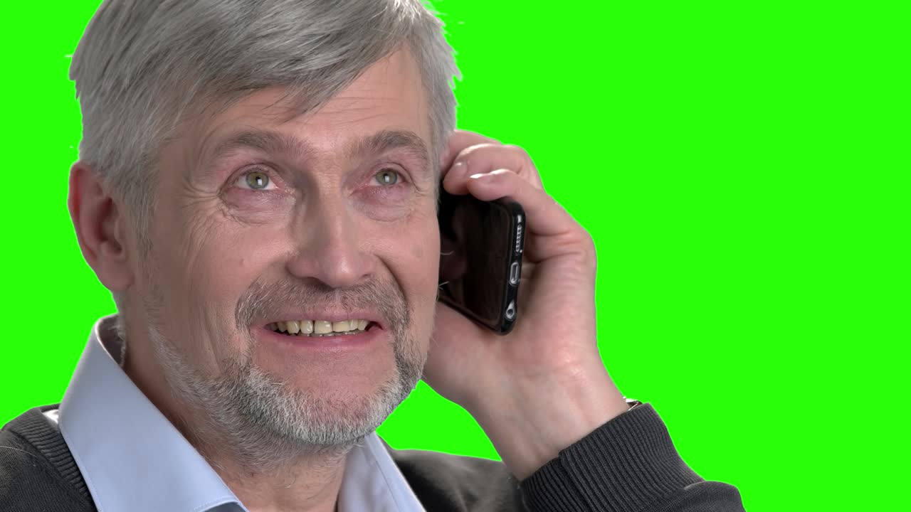 Mature caucasian man talking on phone.