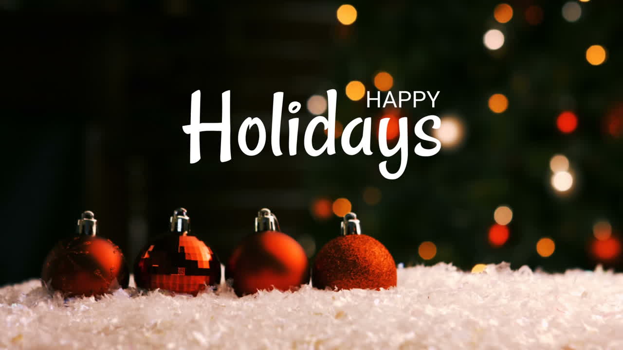 Happy holidays text and Christmas decorations with tree