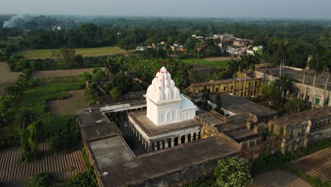 stunning aerial view of a white-colored temple, highlighting its intricate design and serene surroundings.