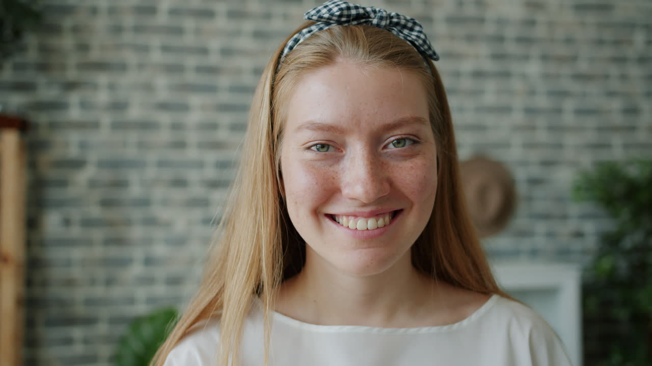 Smiling young woman with a headband