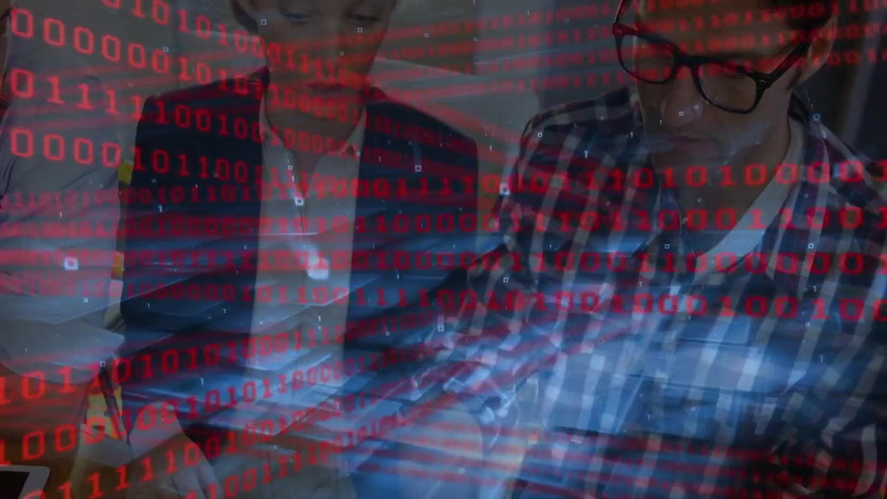 Man in checked shirt starting typing laptop keys woman leaning analyzing tech amid red bits overlay